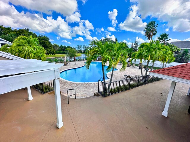 view of pool featuring a patio