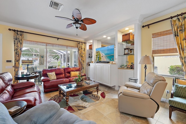 living room featuring ceiling fan, light tile patterned floors, and crown molding