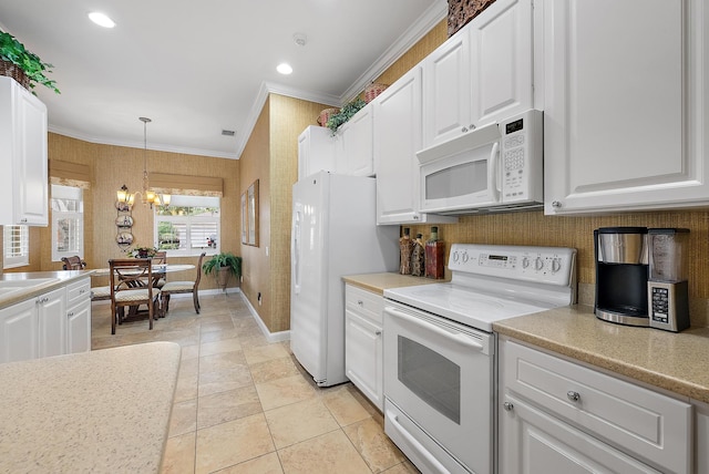 kitchen featuring white appliances, decorative light fixtures, white cabinetry, a notable chandelier, and crown molding