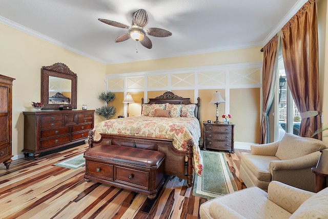 bedroom with ceiling fan, ornamental molding, light hardwood / wood-style floors, and access to outside