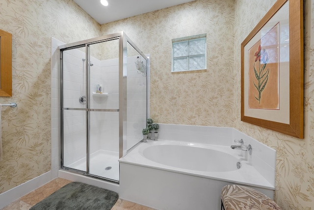 bathroom featuring plus walk in shower and tile patterned floors