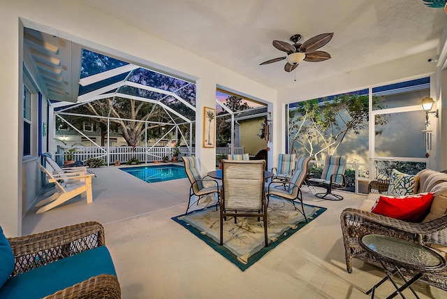 exterior space featuring a patio area, a lanai, and ceiling fan