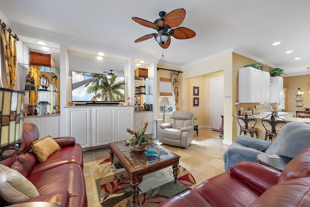 living room featuring ceiling fan and crown molding