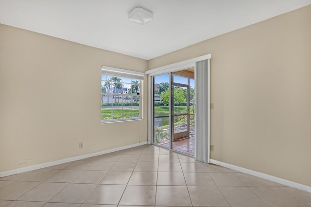 spare room with light tile patterned floors