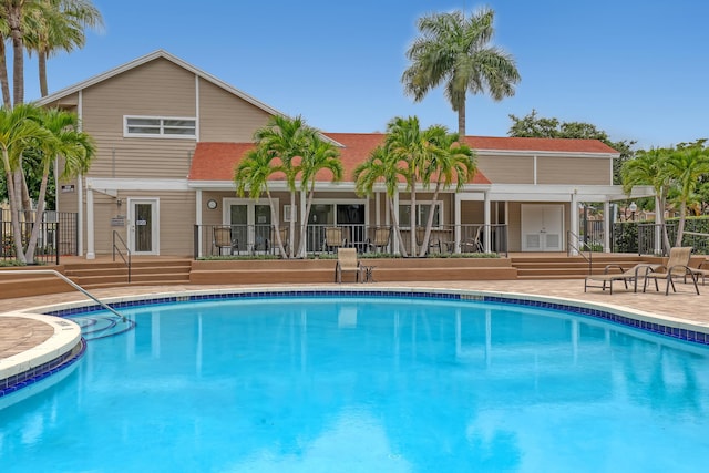 view of swimming pool featuring a patio area