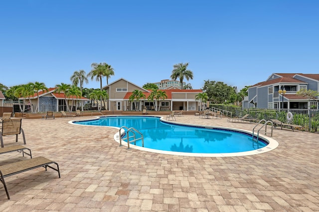 view of swimming pool featuring a patio area