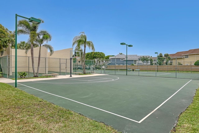 view of basketball court featuring tennis court