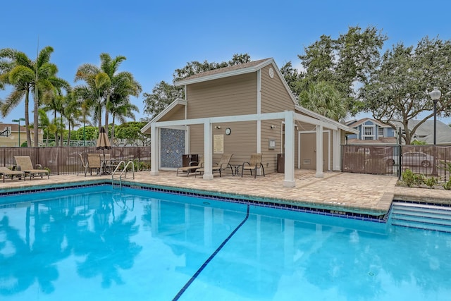 view of swimming pool featuring a patio area