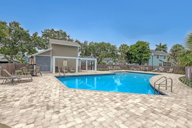 view of swimming pool with a patio area