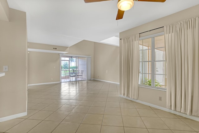 empty room featuring ceiling fan and light tile patterned floors