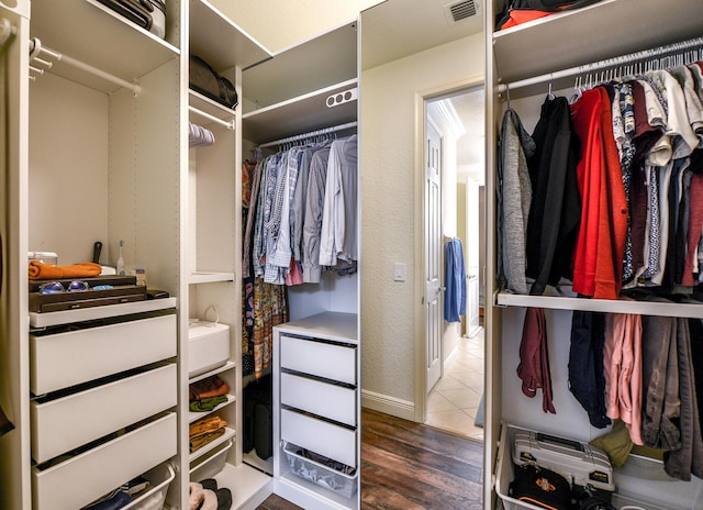 walk in closet featuring wood-type flooring