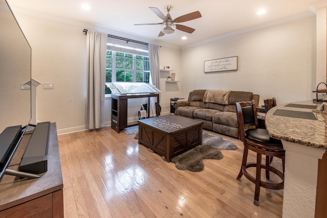 living room with crown molding, sink, ceiling fan, and light hardwood / wood-style floors