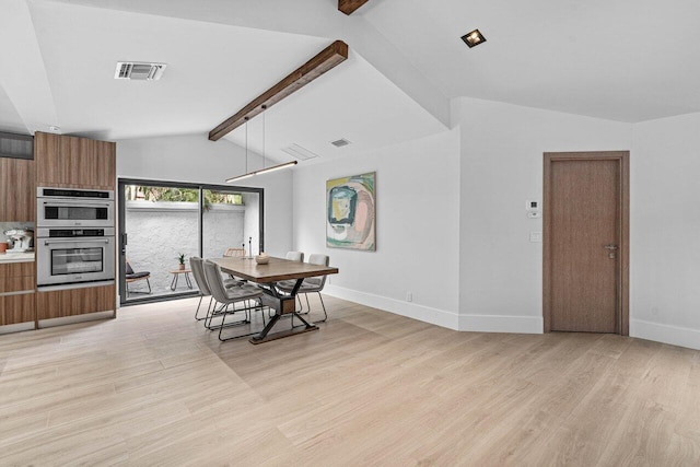 dining space with light wood-type flooring and vaulted ceiling with beams