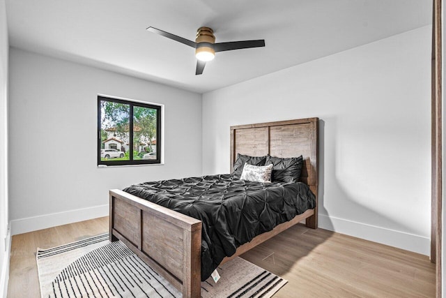 bedroom featuring ceiling fan and light hardwood / wood-style flooring