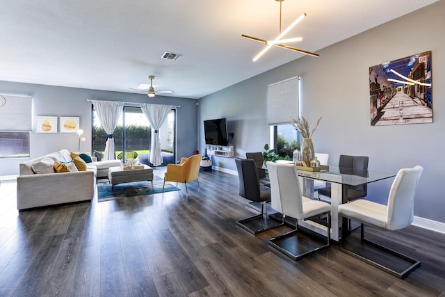 dining room featuring dark hardwood / wood-style flooring and a chandelier