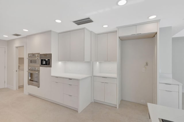 kitchen with white cabinets and stainless steel double oven