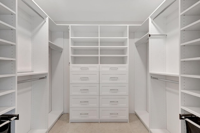 walk in closet featuring light tile patterned flooring