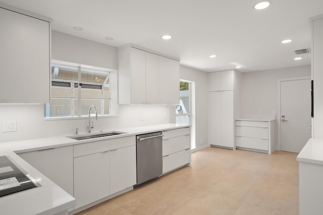 2371 SW Brookwood Ln, Palm City, FL 34990 - kitchen with a sink, dishwasher, white cabinetry, light countertops, and recessed lighting