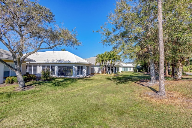 2371 SW Brookwood Ln, Palm City, FL 34990 - view of green lawn with a sunroom
