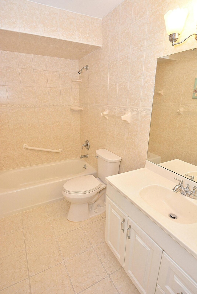 1225 NW 21st St Unit 3406, Stuart, FL 34994 - bathroom featuring tile patterned floors, toilet, shower / tub combination, vanity, and tile walls