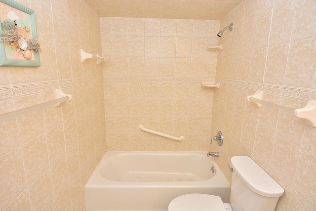 1225 NW 21st St Unit 3406, Stuart, FL 34994 - full bathroom featuring toilet, tile walls, and shower / bath combination