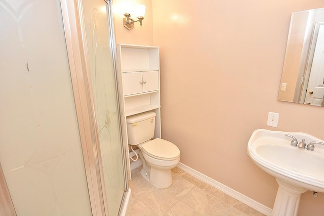 1225 NW 21st St Unit 3406, Stuart, FL 34994 - full bath featuring baseboards, toilet, tile patterned flooring, a sink, and a shower stall