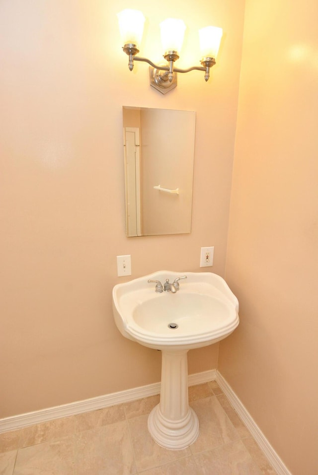 1225 NW 21st St Unit 3406, Stuart, FL 34994 - bathroom with baseboards, tile patterned floors, and a sink
