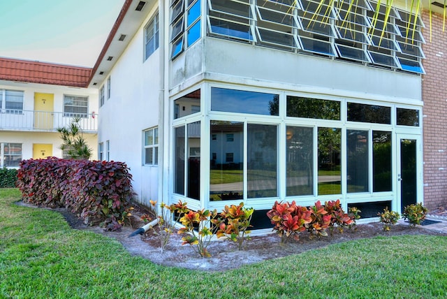 1225 NW 21st St Unit 3406, Stuart, FL 34994 - view of side of property with a yard and stucco siding