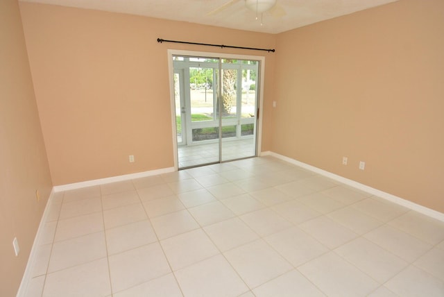 1225 NW 21st St Unit 3406, Stuart, FL 34994 - unfurnished room with baseboards, a ceiling fan, and light tile patterned floors