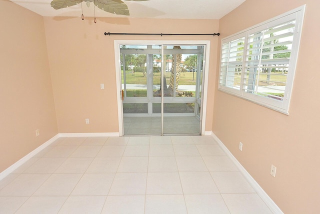 1225 NW 21st St Unit 3406, Stuart, FL 34994 - tiled empty room featuring baseboards and a ceiling fan