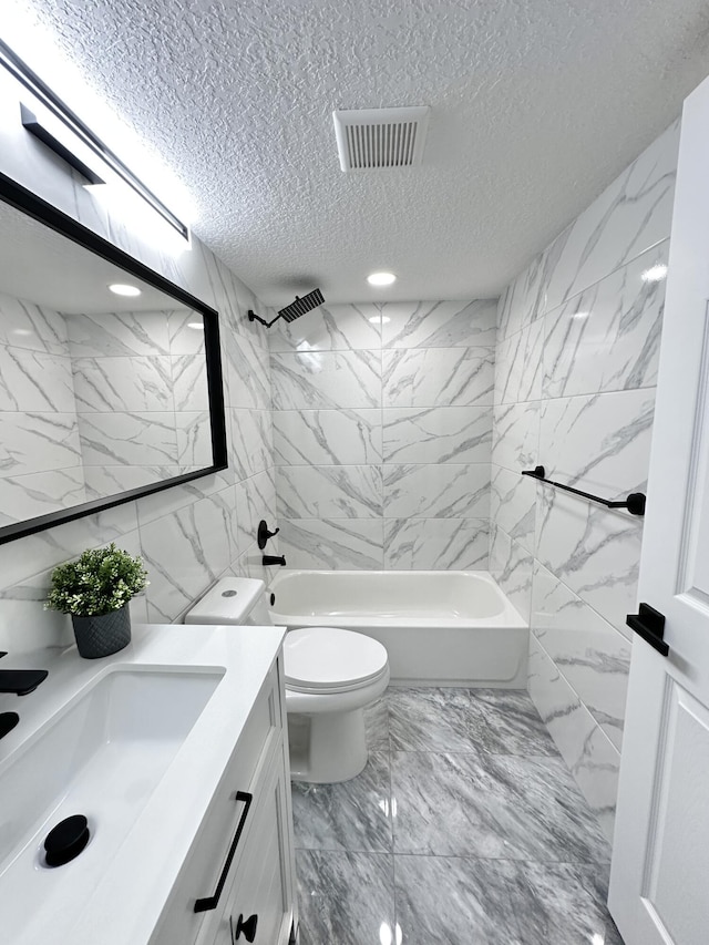 full bathroom featuring shower / bathing tub combination, vanity, toilet, and a textured ceiling