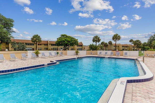 view of swimming pool featuring a patio