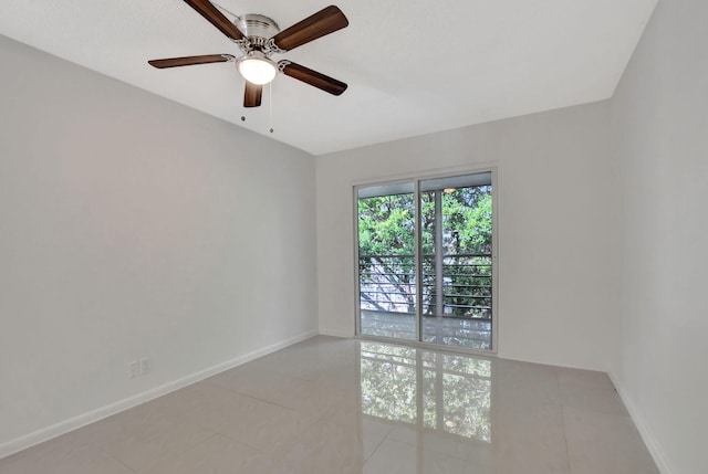 spare room featuring ceiling fan and light tile patterned floors