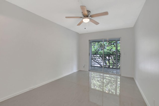 tiled empty room with ceiling fan