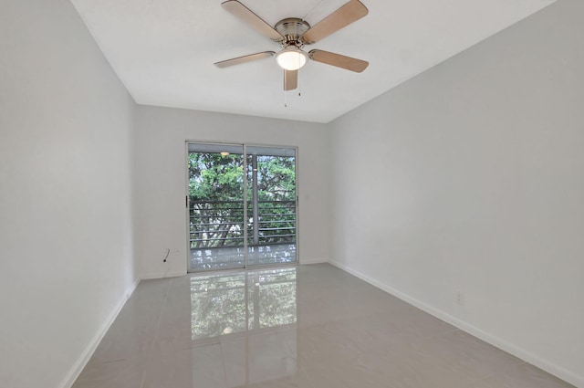 tiled empty room with ceiling fan