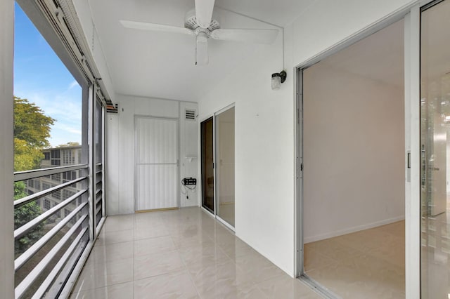 balcony featuring ceiling fan