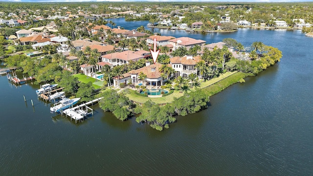 drone / aerial view featuring a water view and a residential view