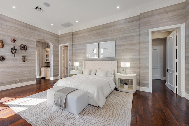 bedroom featuring crown molding and hardwood / wood-style floors