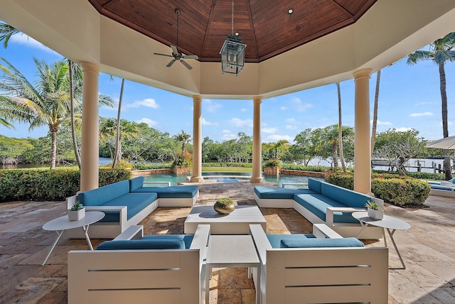 view of patio / terrace with ceiling fan and an outdoor living space