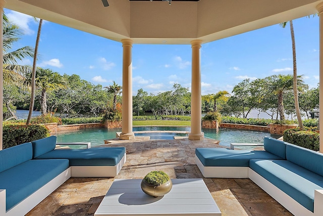 view of patio with a swimming pool with hot tub and outdoor lounge area