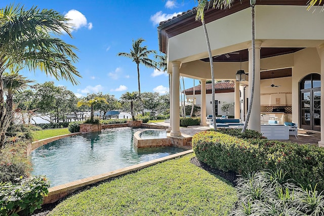 view of swimming pool featuring a patio area, french doors, and ceiling fan