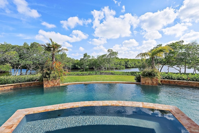 view of swimming pool with a water view