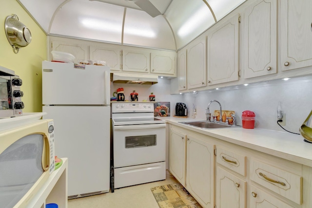 kitchen featuring sink and white appliances