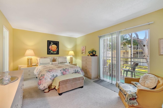 carpeted bedroom featuring access to outside