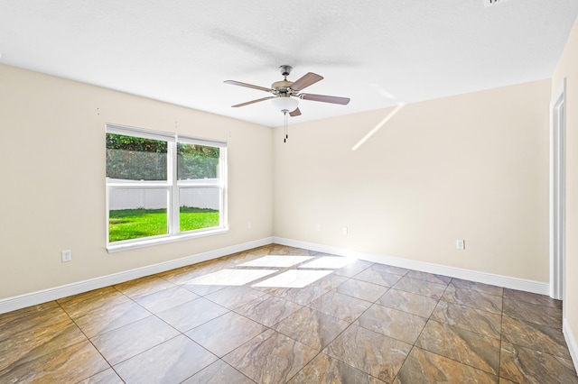 spare room featuring ceiling fan