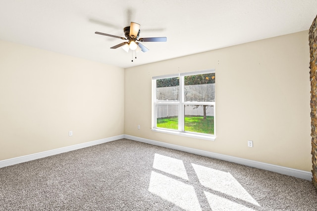 empty room with carpet and ceiling fan