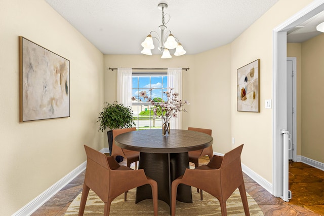 dining space featuring an inviting chandelier