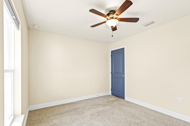 spare room with ceiling fan