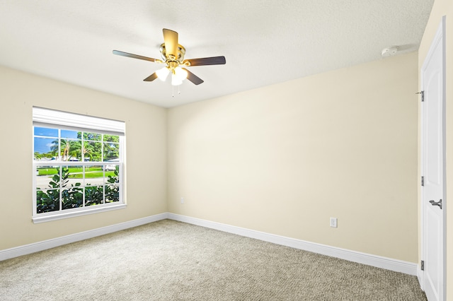 unfurnished room featuring carpet and ceiling fan