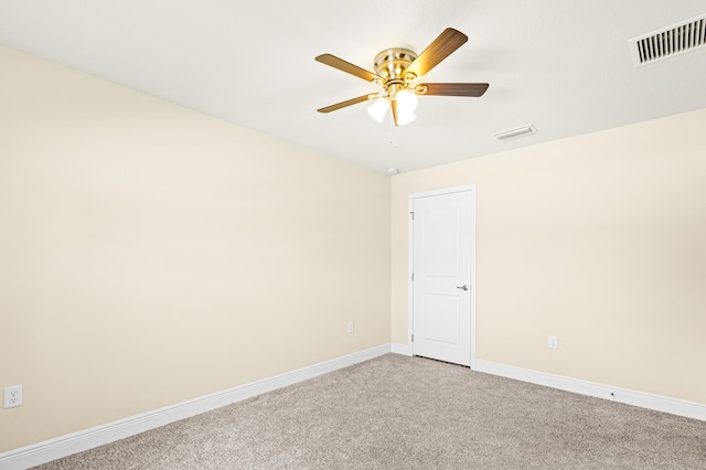 carpeted empty room featuring ceiling fan